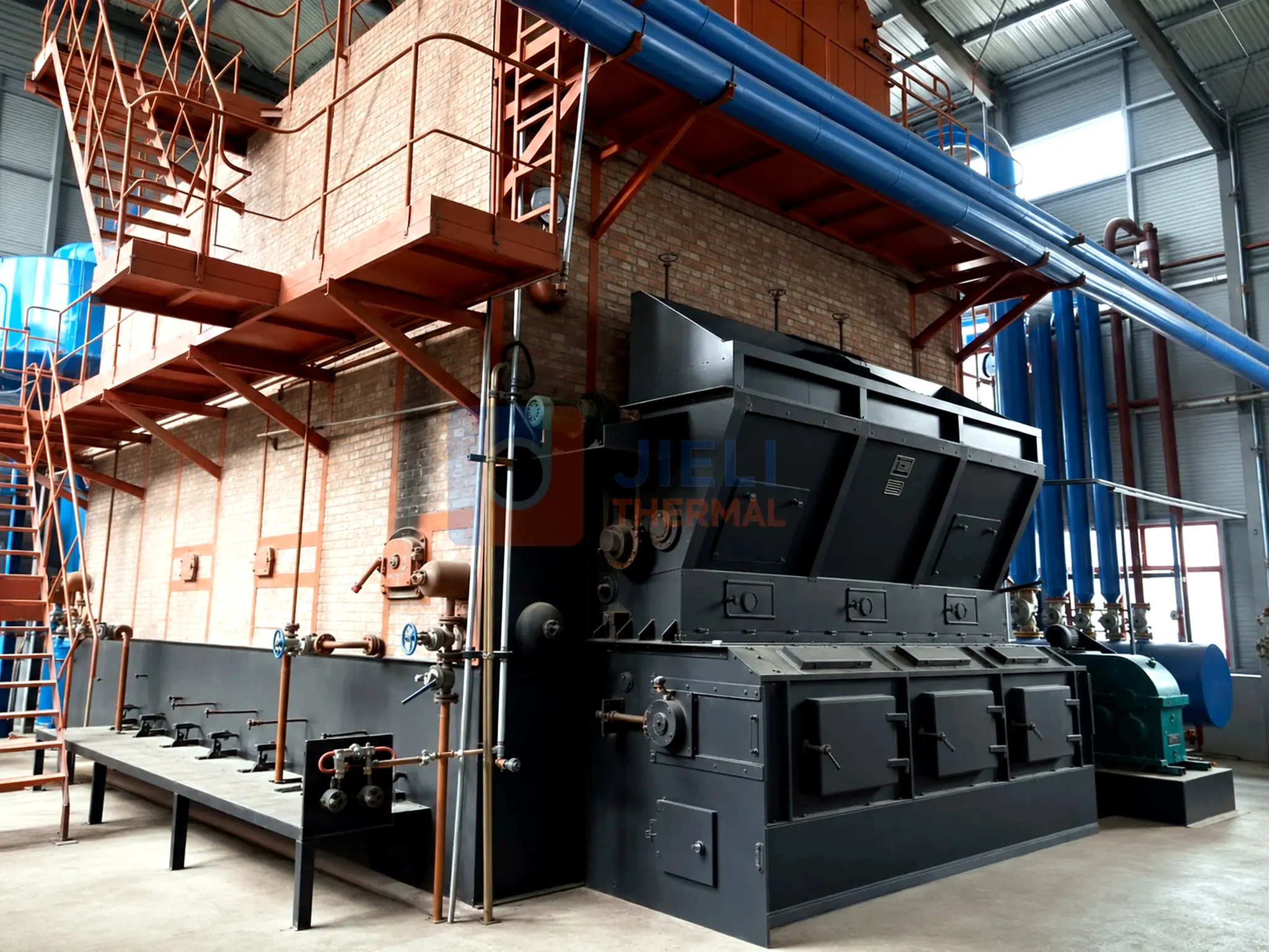 Biomass-fired steam boiler — reciprocating grate and automatic fuel pusher