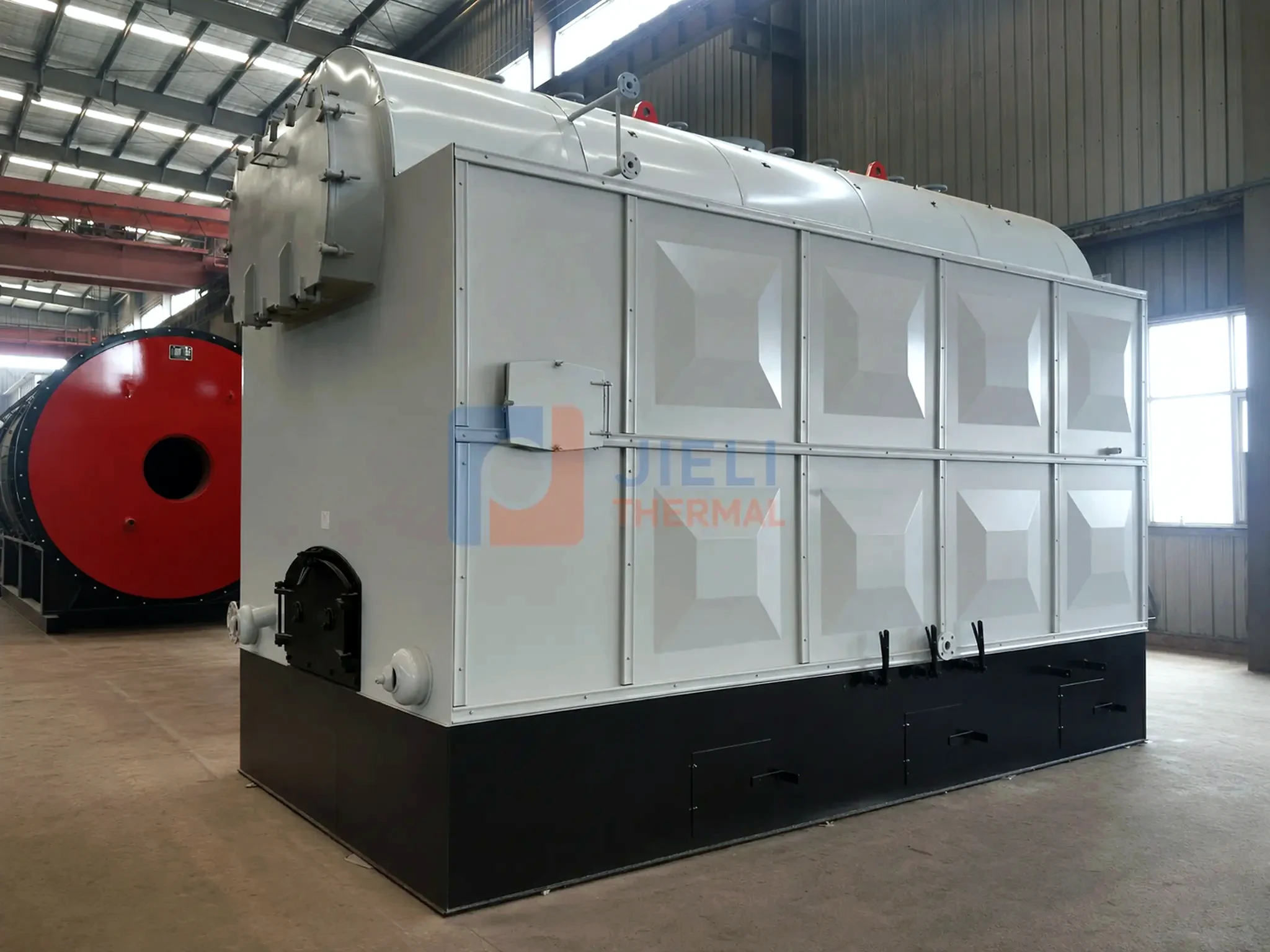 Biomass-fired steam boiler — rear and side view in the workshop