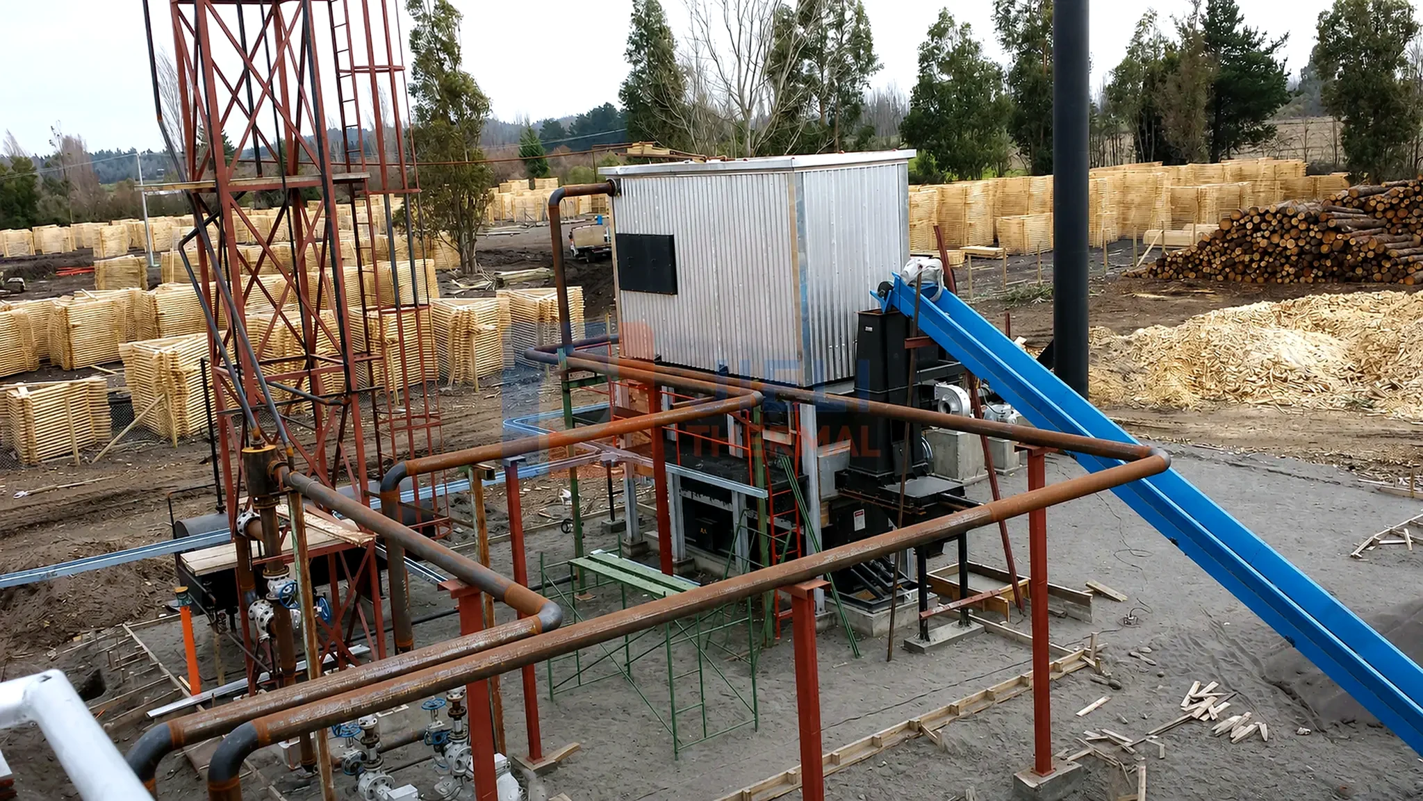 Biomass-fired thermal oil heater — project installation with biomass conveyor