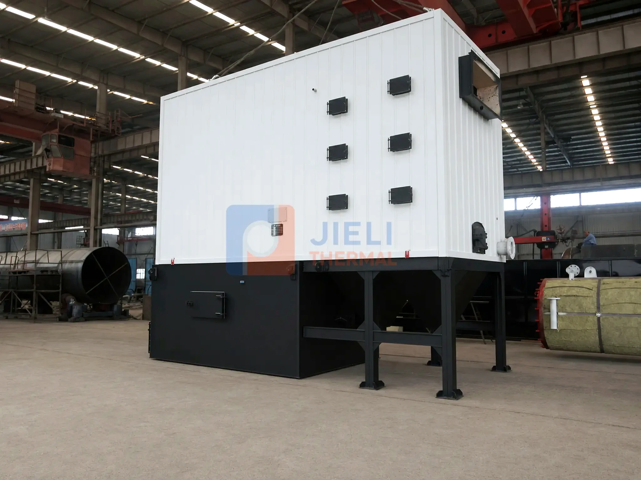 Biomass-fired thermal oil heater — front view in the production workshop