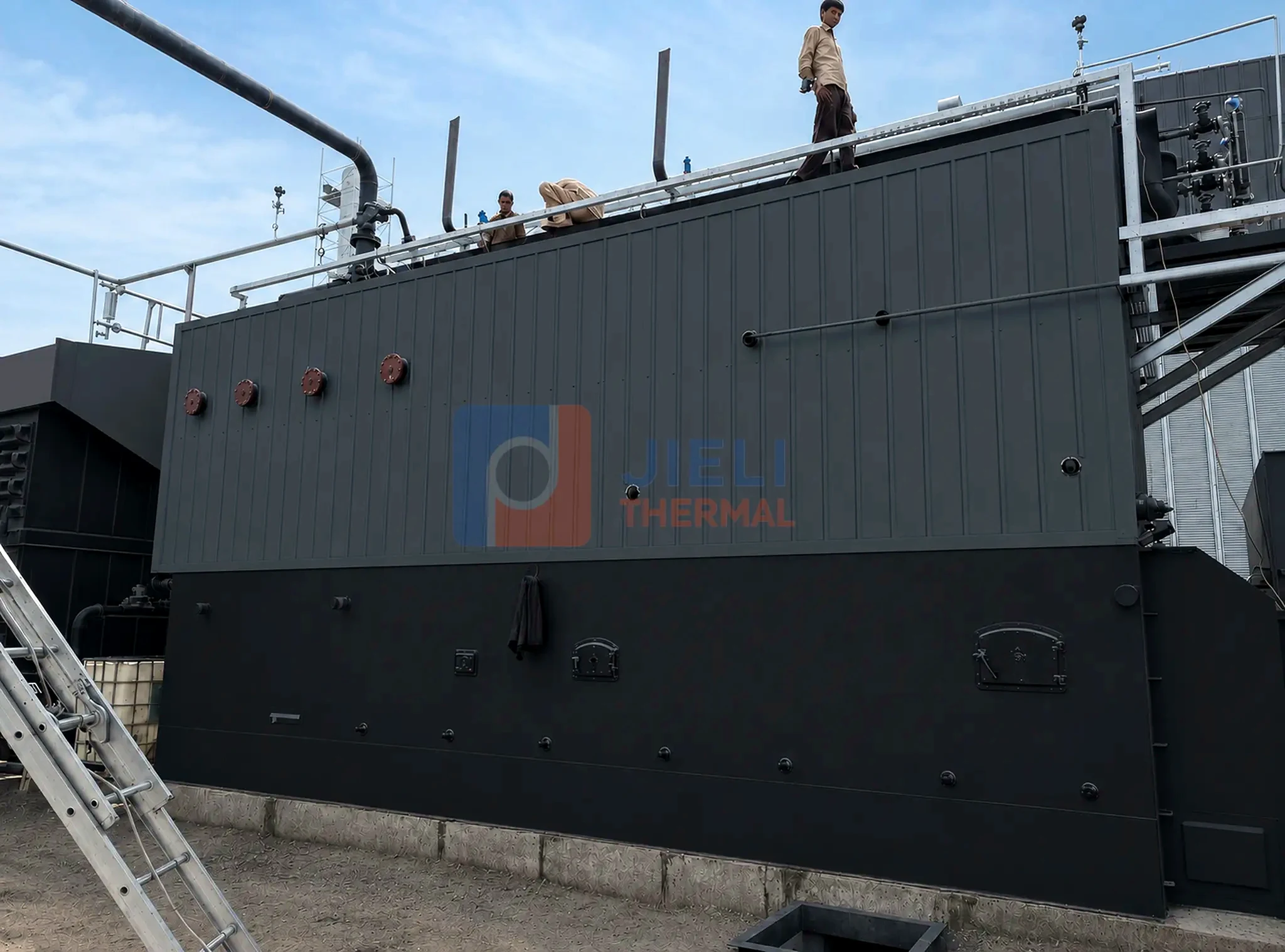Coal-fired steam boiler — side view in the production workshop
