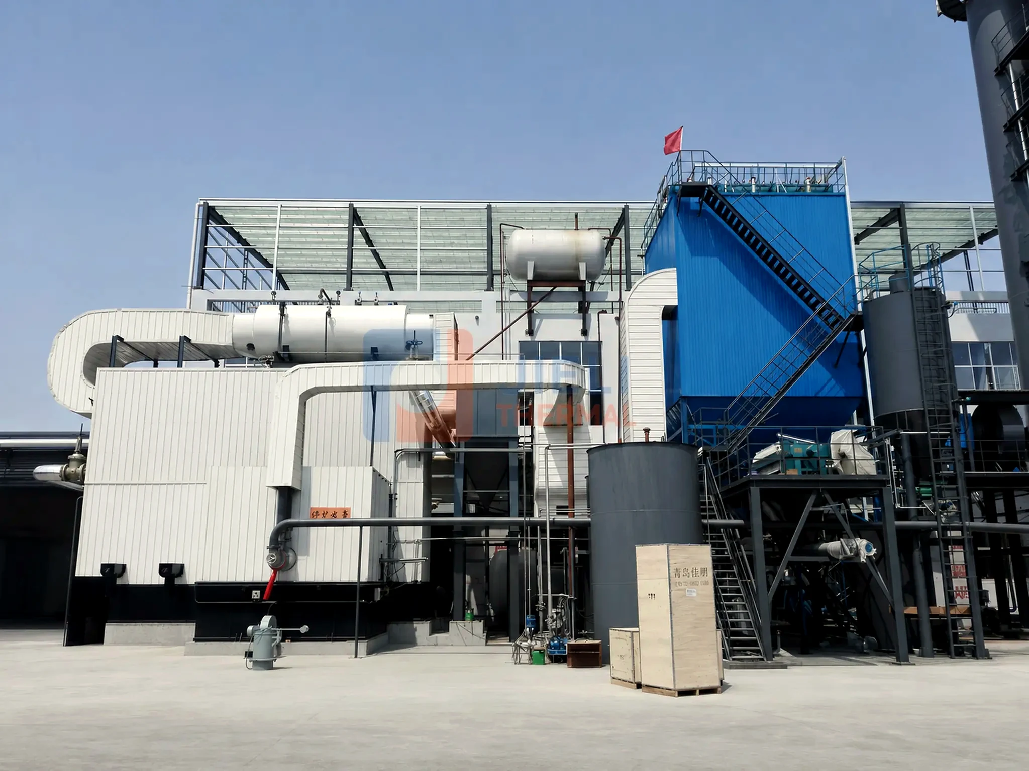 Coal-fired thermal oil heater — complete industrial installation with draft and dust-control equipment