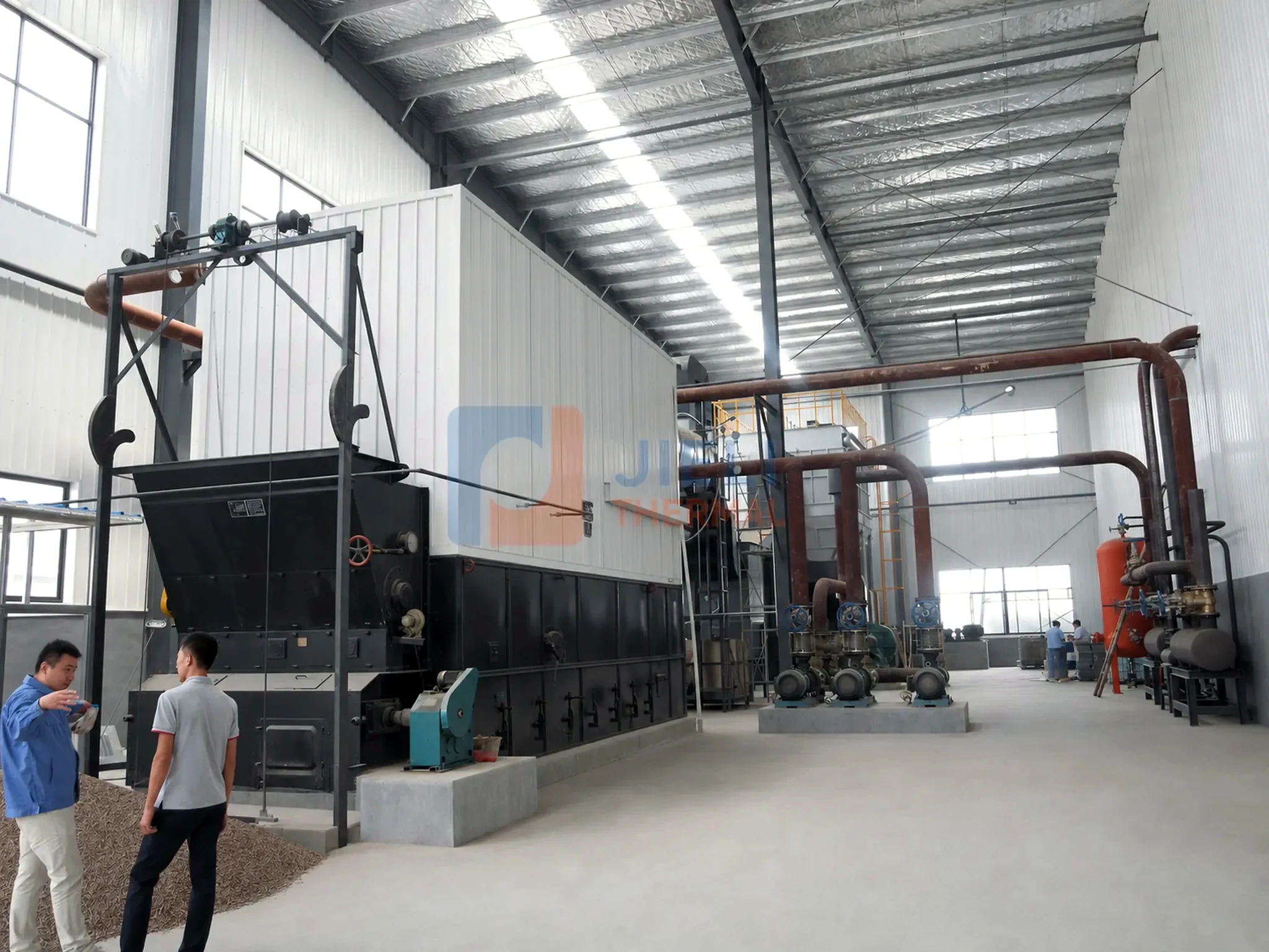 Coal-fired thermal oil heater — installed side view with process piping