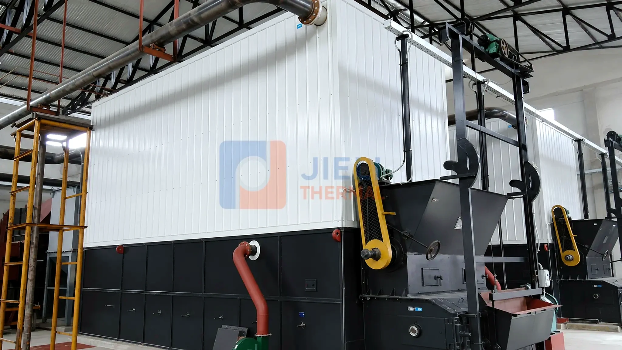 Coal-fired thermal oil heater — twin chain-grate units installed in one boiler house