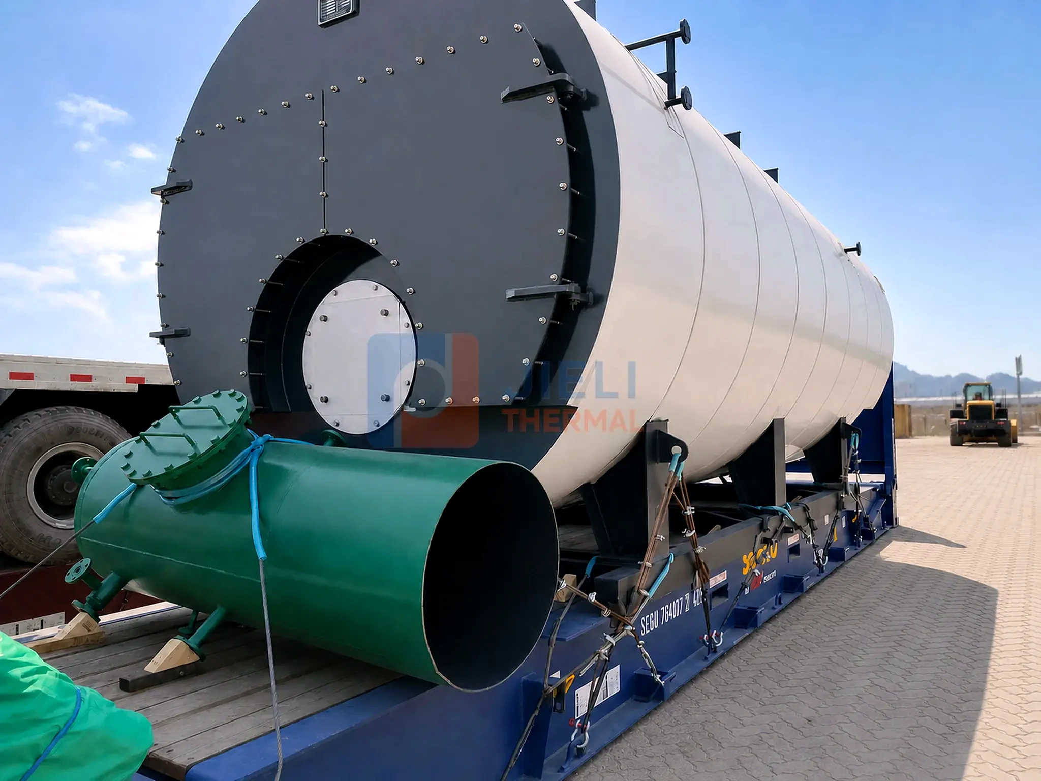 Gas / oil-fired steam boiler shell secured on a road trailer
