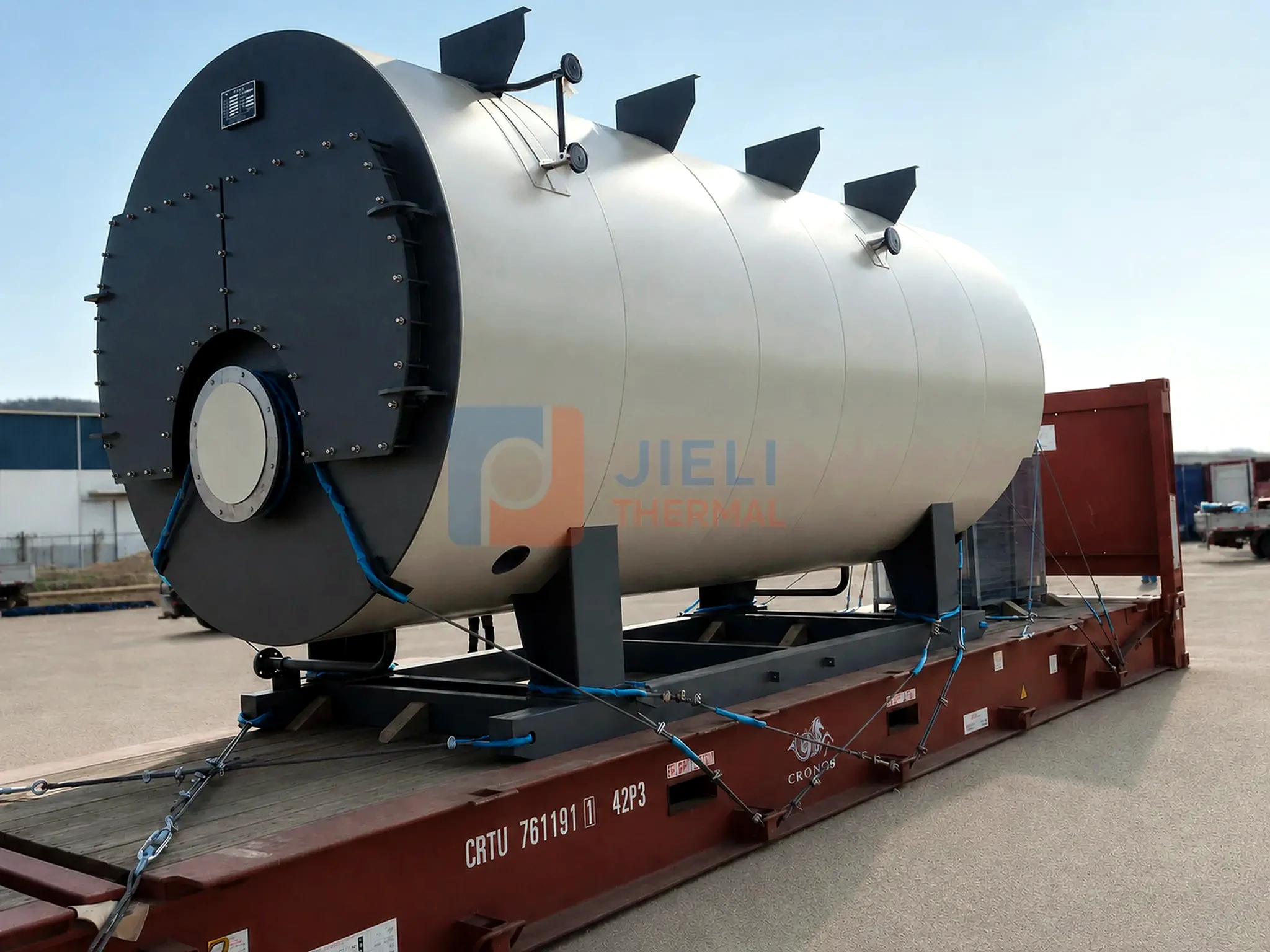 Rear view of a packaged gas / oil steam boiler secured to a truck