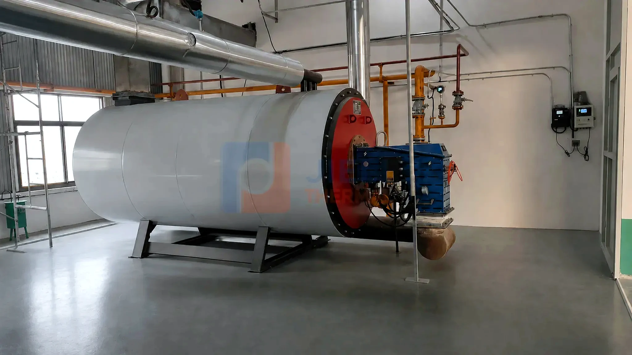 Gas / oil-fired thermal oil heater — installed side view with process piping