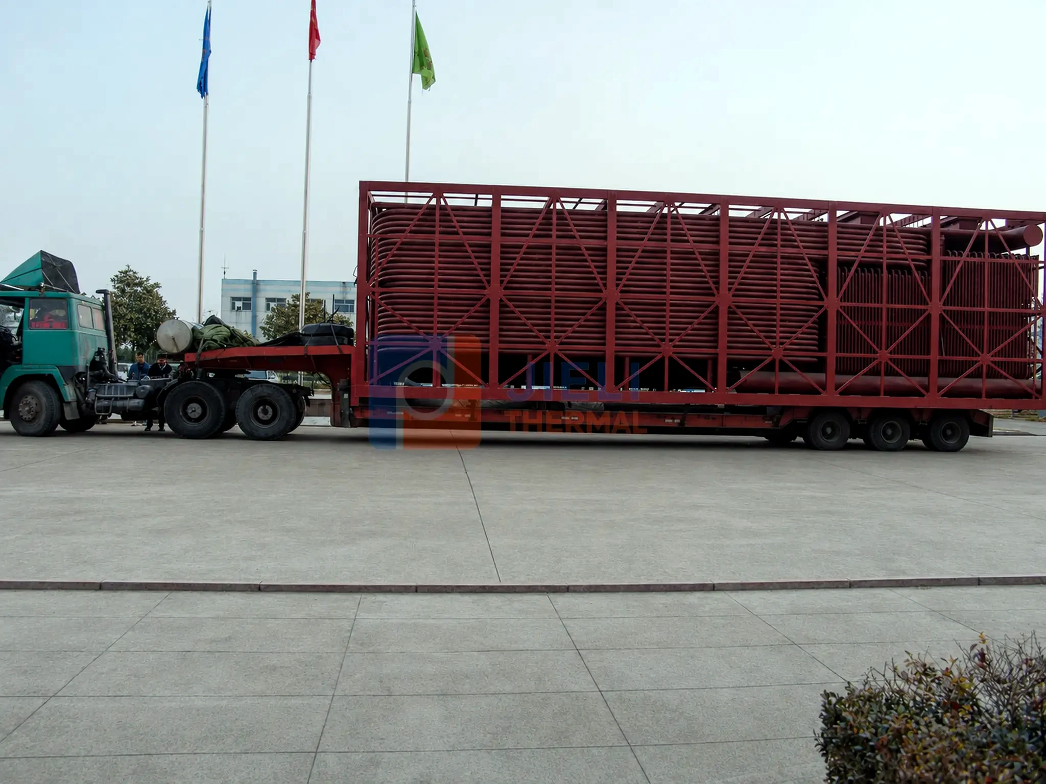 Industrial boiler export delivery — water-tube coil module secured for road delivery