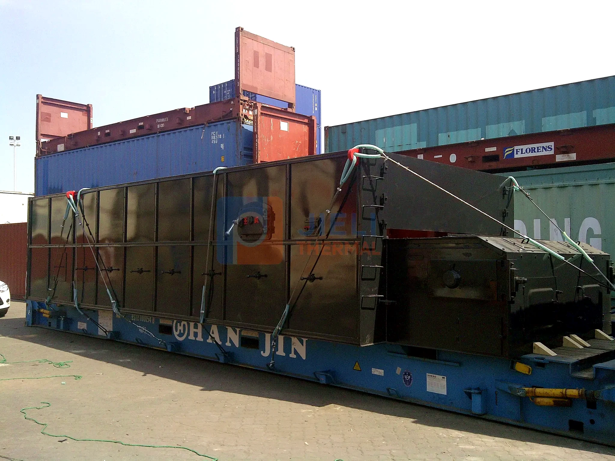 Industrial boiler export delivery — coal-fired boiler module secured for flat-rack delivery