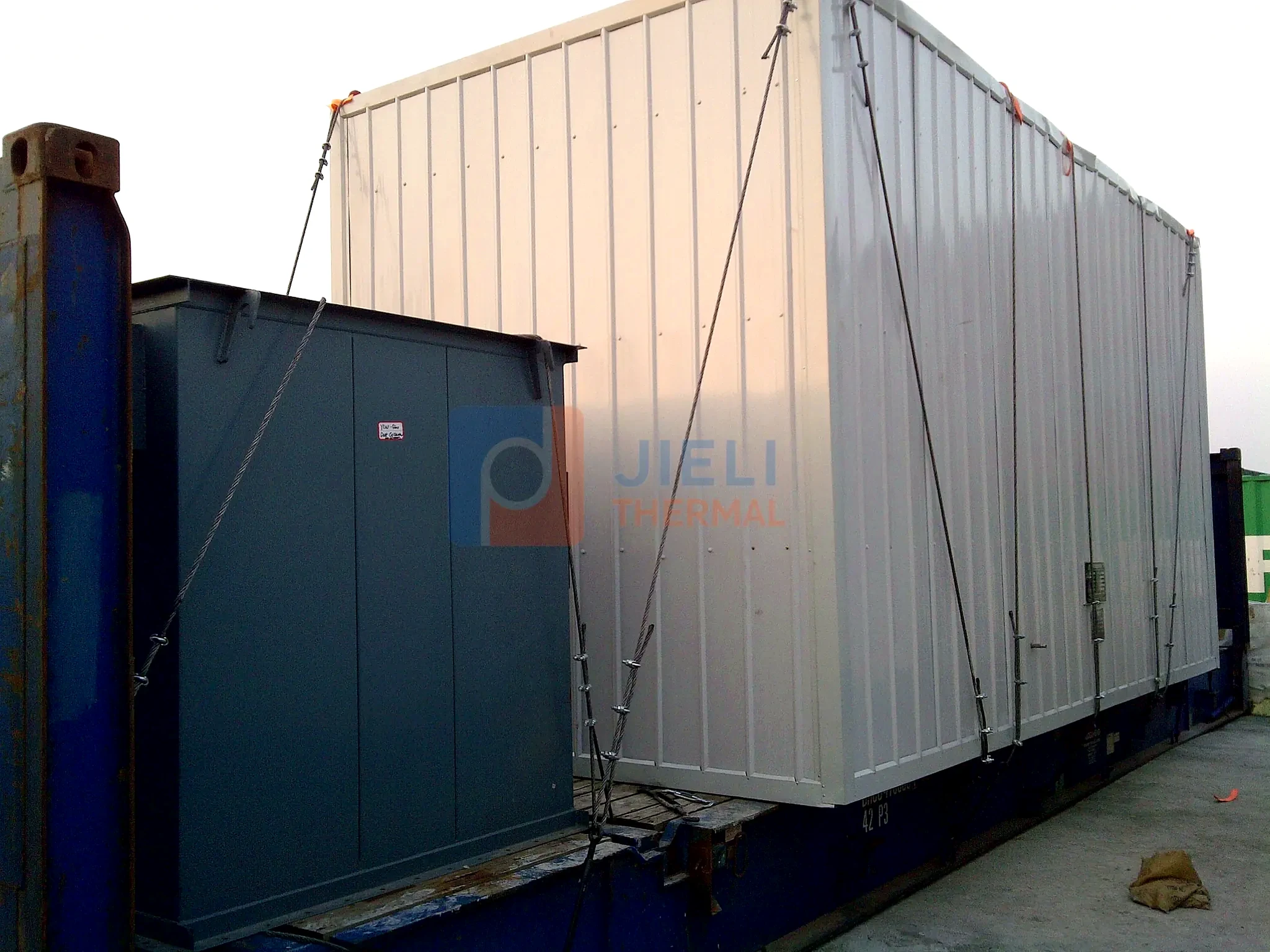 Industrial boiler export delivery — containerized boiler package secured for export