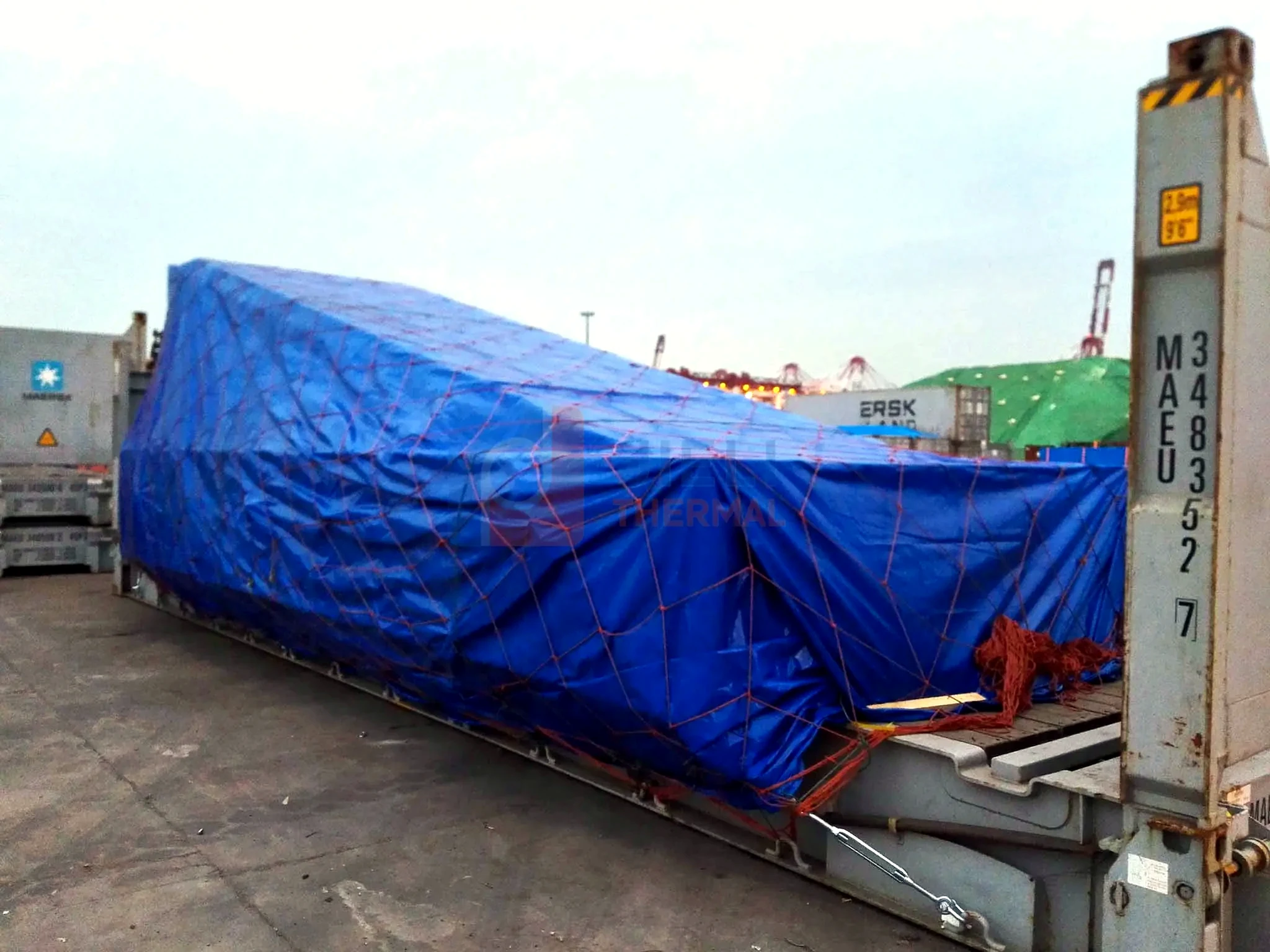 Industrial boiler export delivery — long boiler module protected for flat-rack delivery