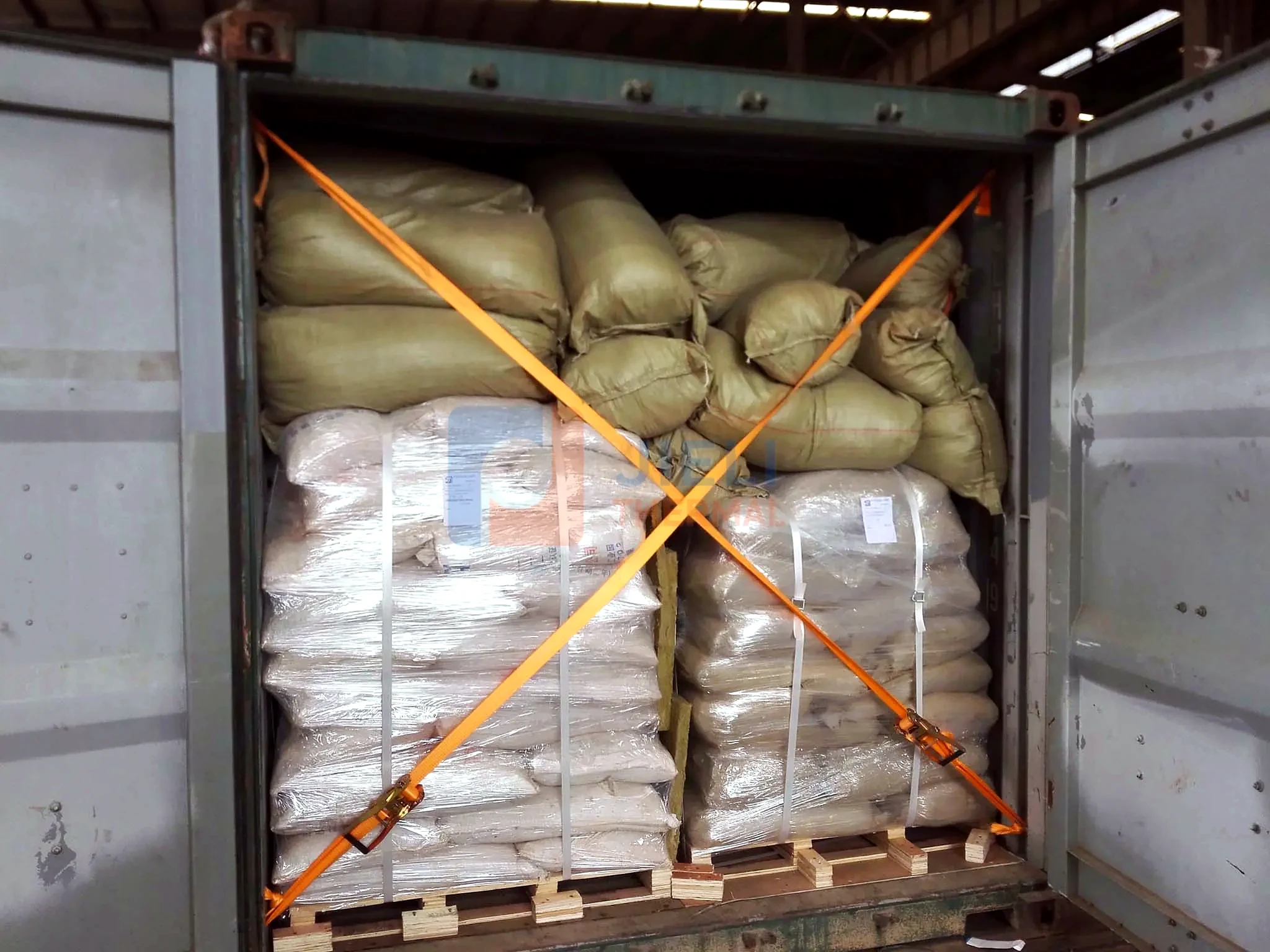 Industrial boiler export delivery — packed boiler auxiliaries secured in a container