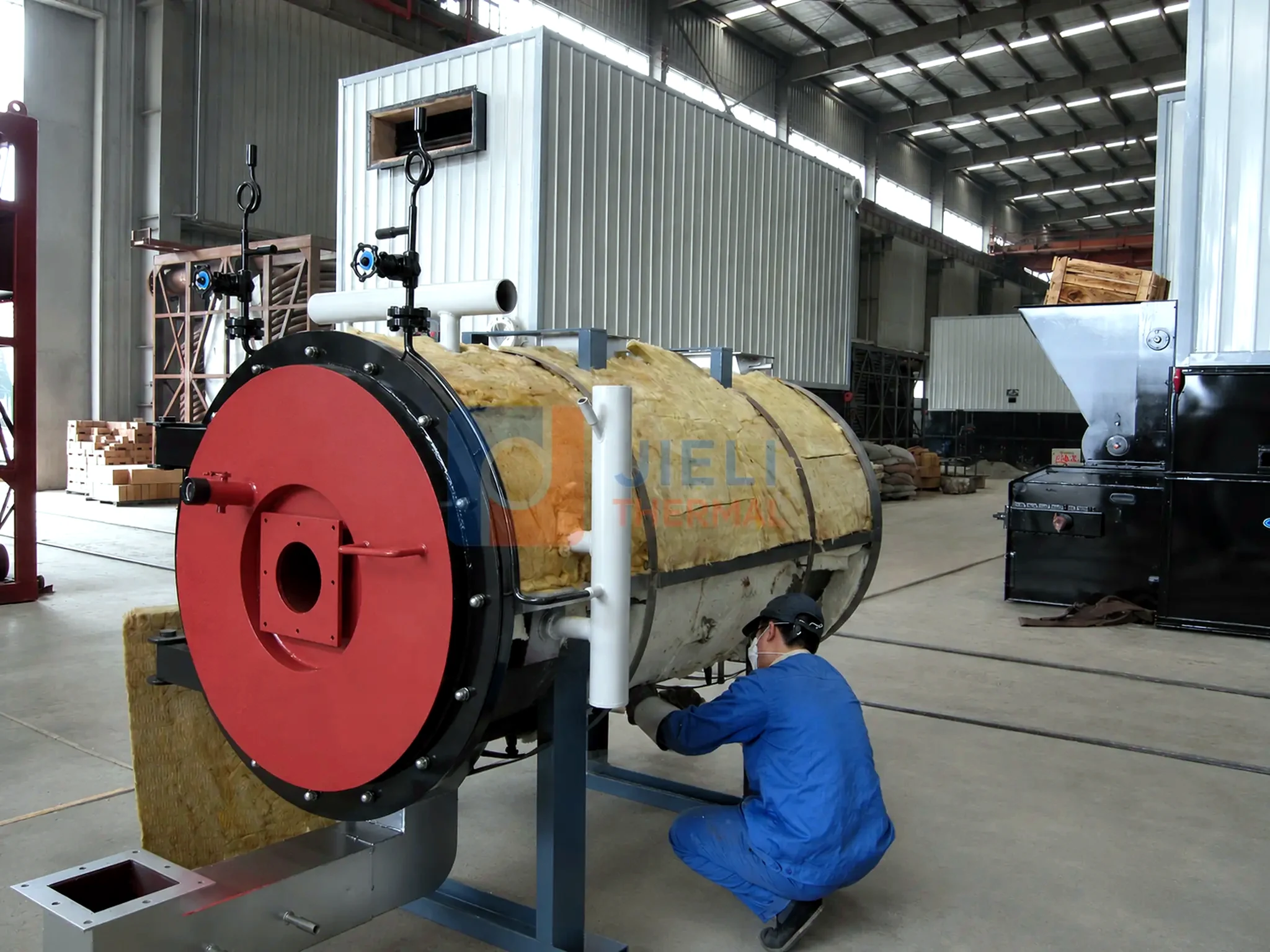 JIELI THERMAL boiler manufacturing — boiler insulation and final assembly in the workshop
