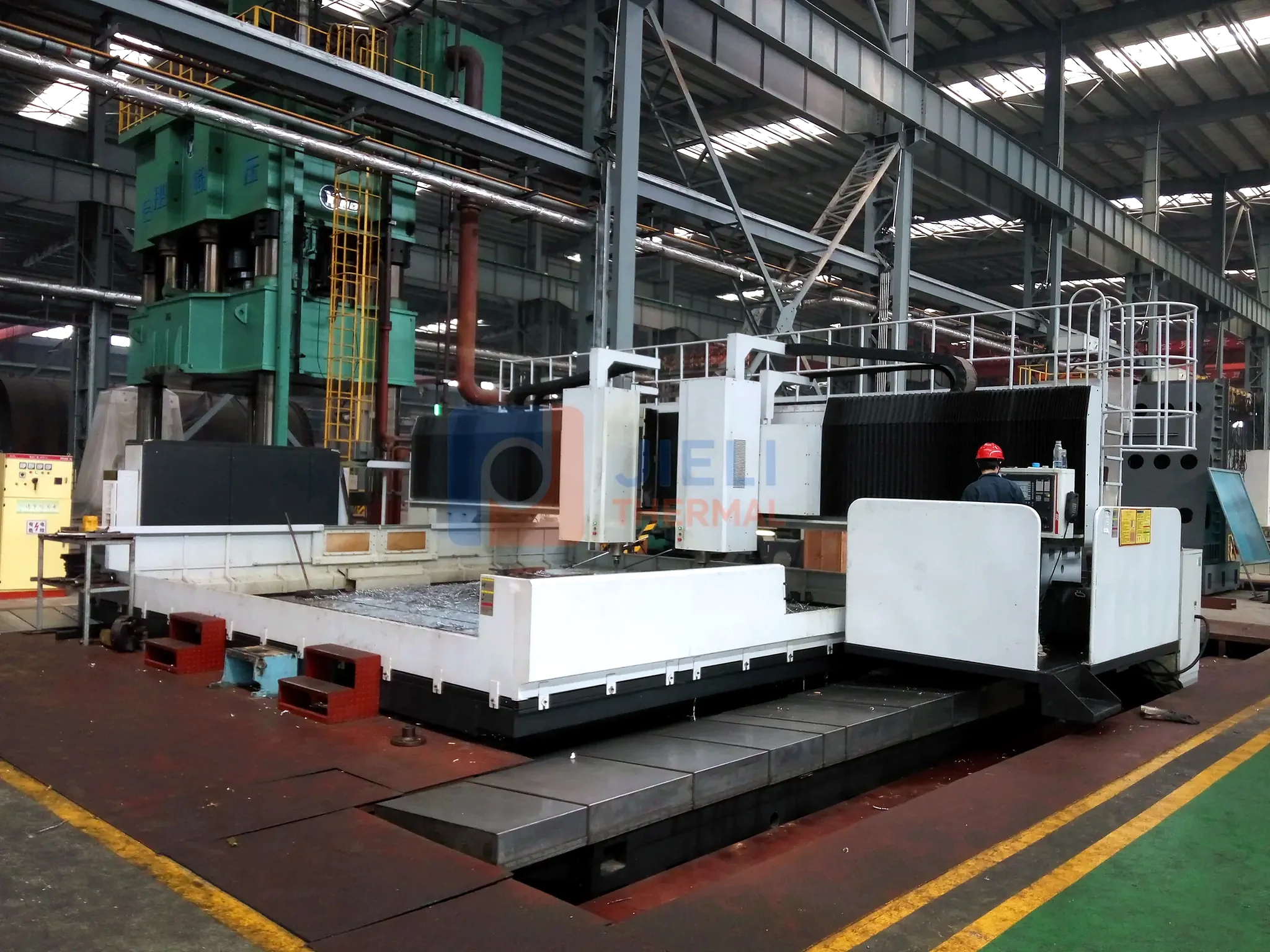 JIELI THERMAL boiler manufacturing — heavy pressure-part machining on a floor-type boring mill
