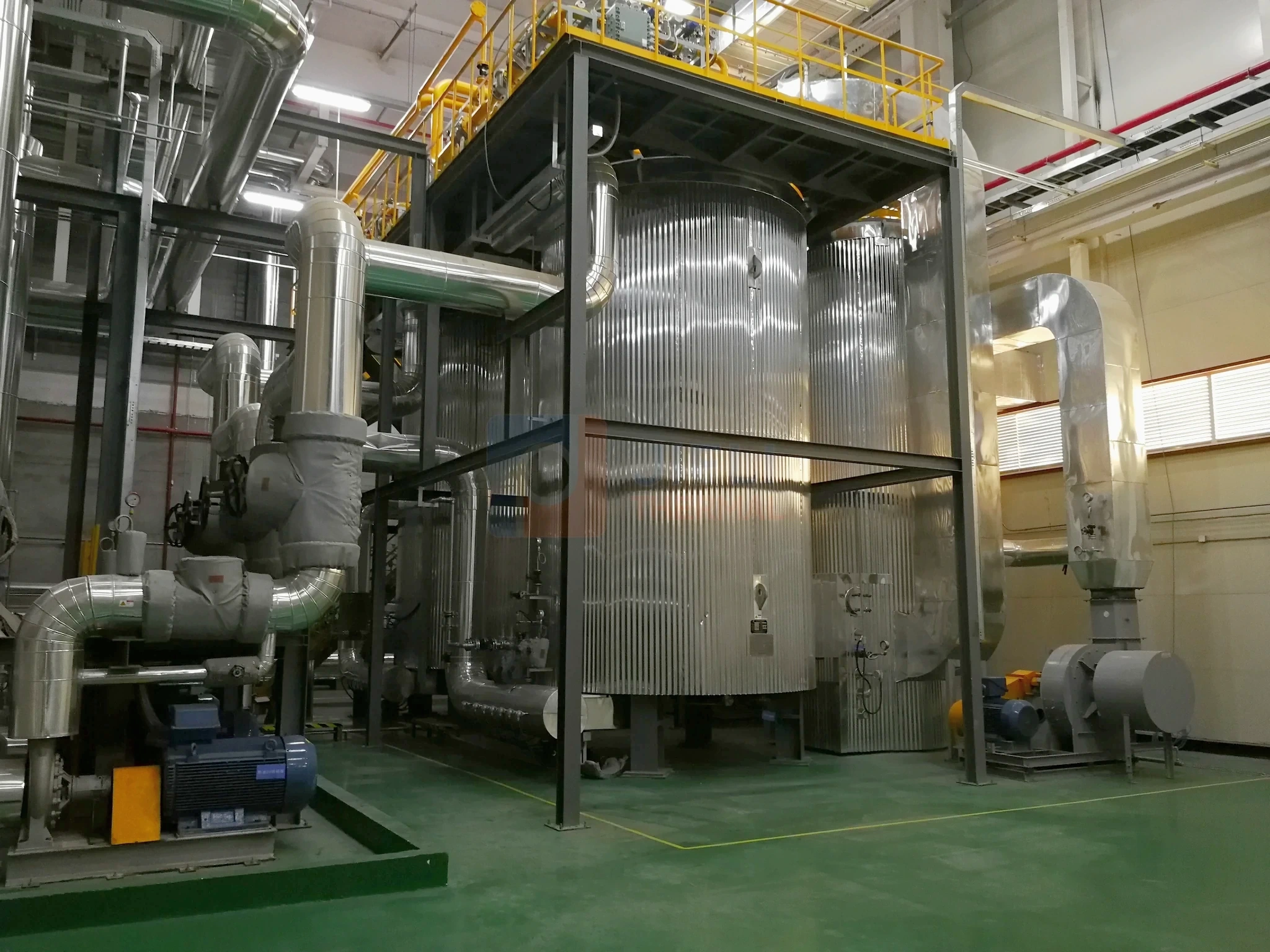 Complete gas-fired thermal oil heating system with process vessels, piping and integrated auxiliaries