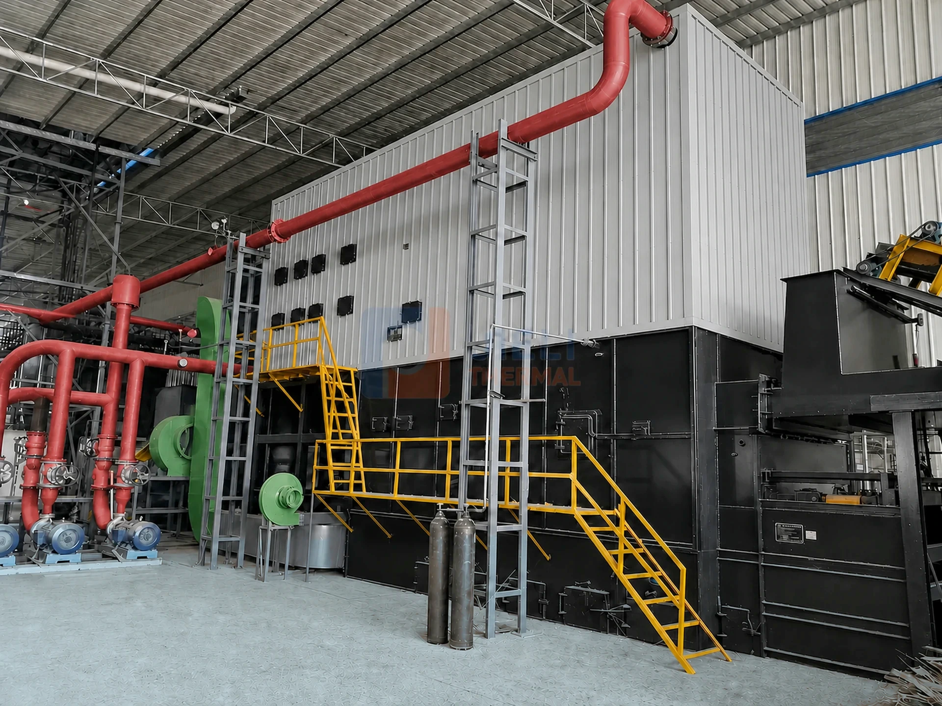 Thailand 8,000,000 kcal/h biomass-fired thermal oil heater installation with silver cladding, fuel-feed equipment and service platforms