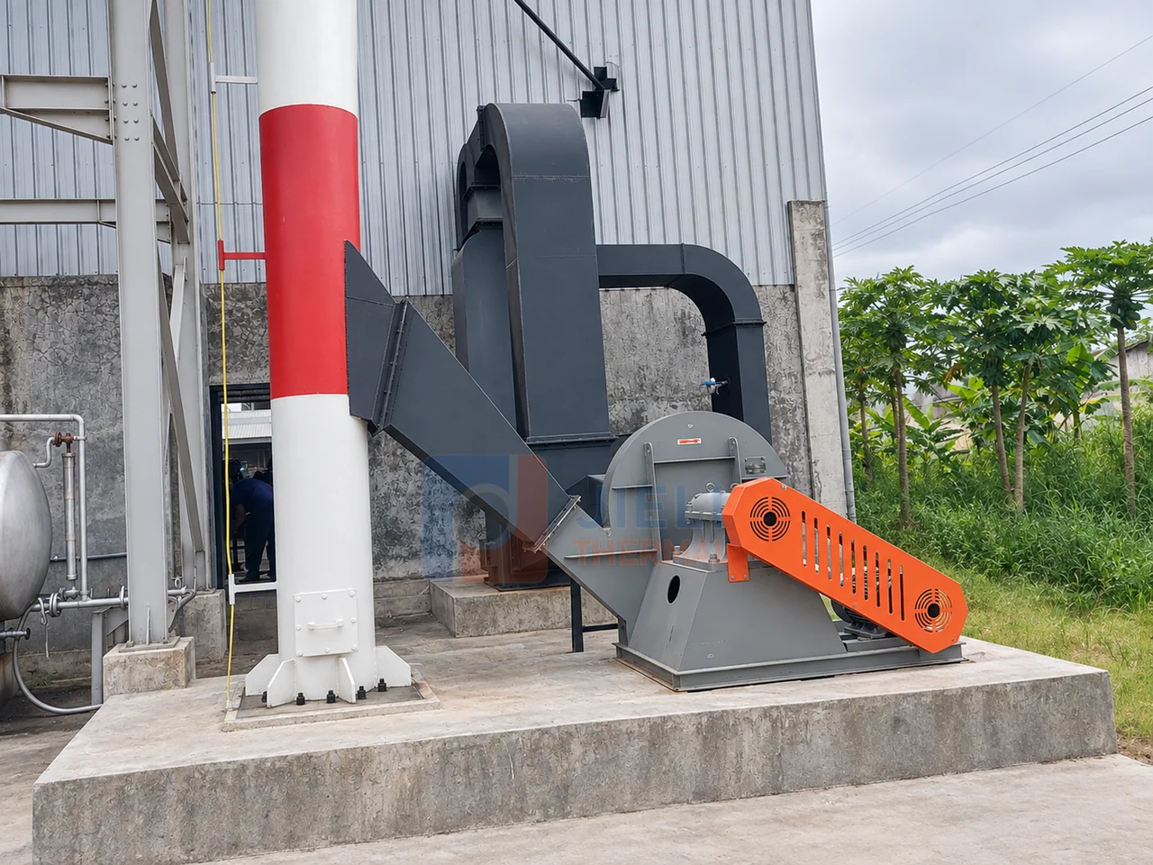 Induced-draft fan, flue duct and chimney at the Indonesia biomass thermal oil heater installation