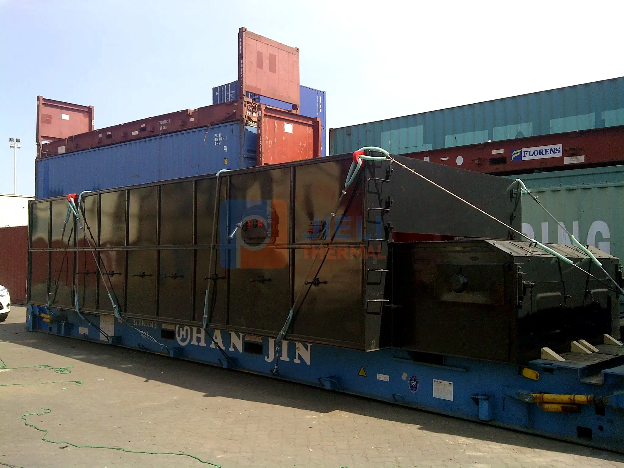 Solid-fuel boiler secured on a flat-rack container for international delivery